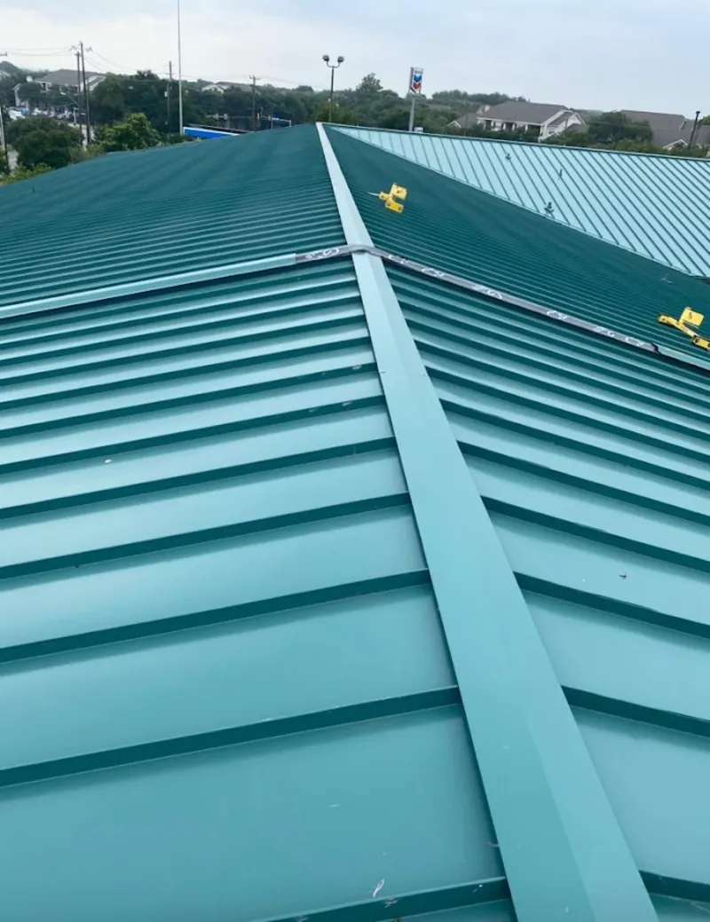 Green commercial metal roof ridge and valley for Metal Roof Repair in Lake Holiday